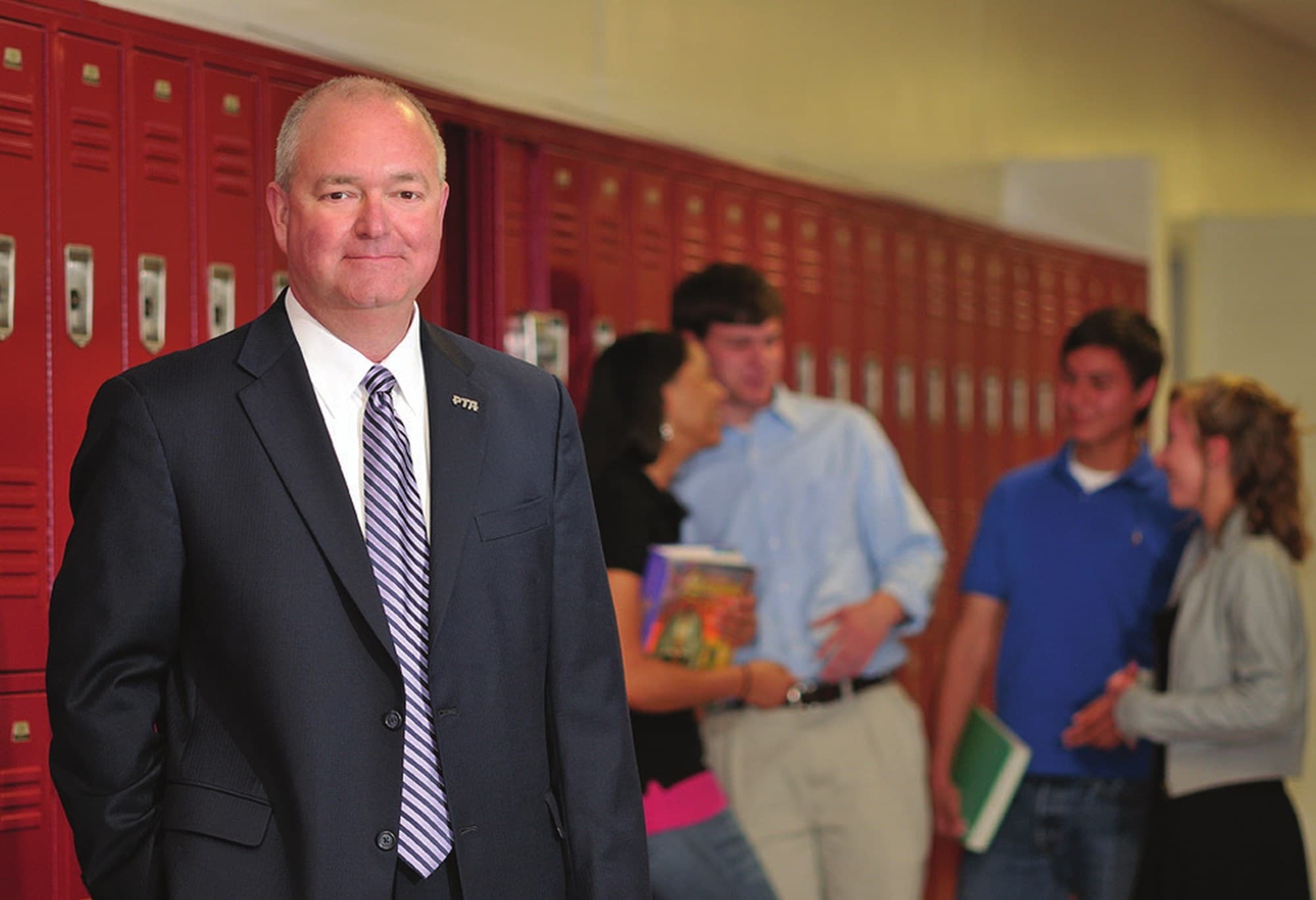 Chuck Saylors in a Greenville County school hallway